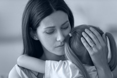 mother hugging daughter